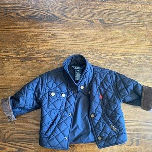 Quilted water repellent jacket with corduroy sleeve.